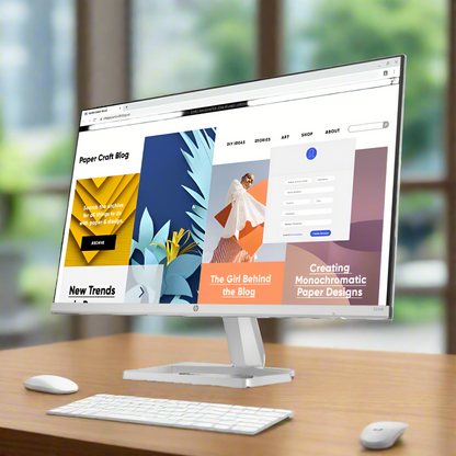 Computer monitor displaying a website with colorful design elements on a white background